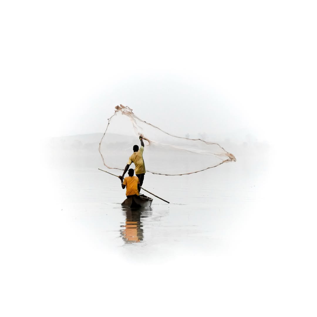Silhouetted fishermen preparing nets on a narrow wooden boat
