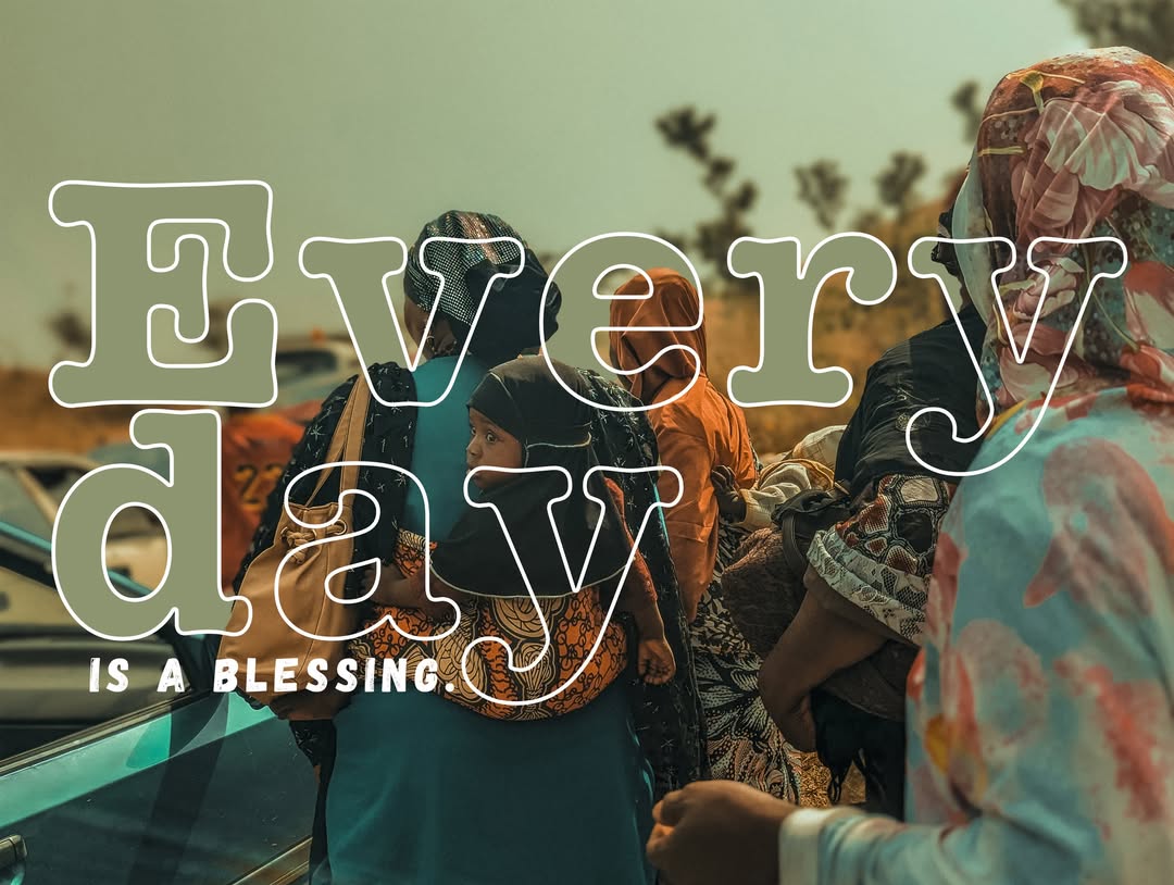 Every day is a blessing — women and child in colorful fabrics
